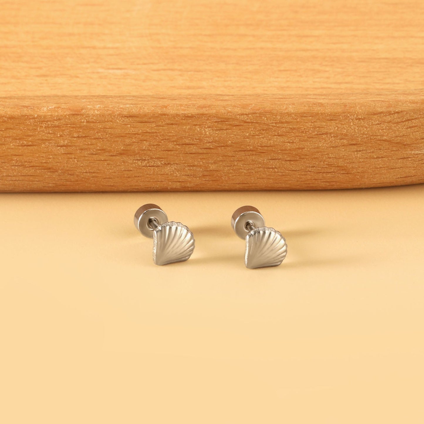 12 pairs shell shape screw-in earrings steel color