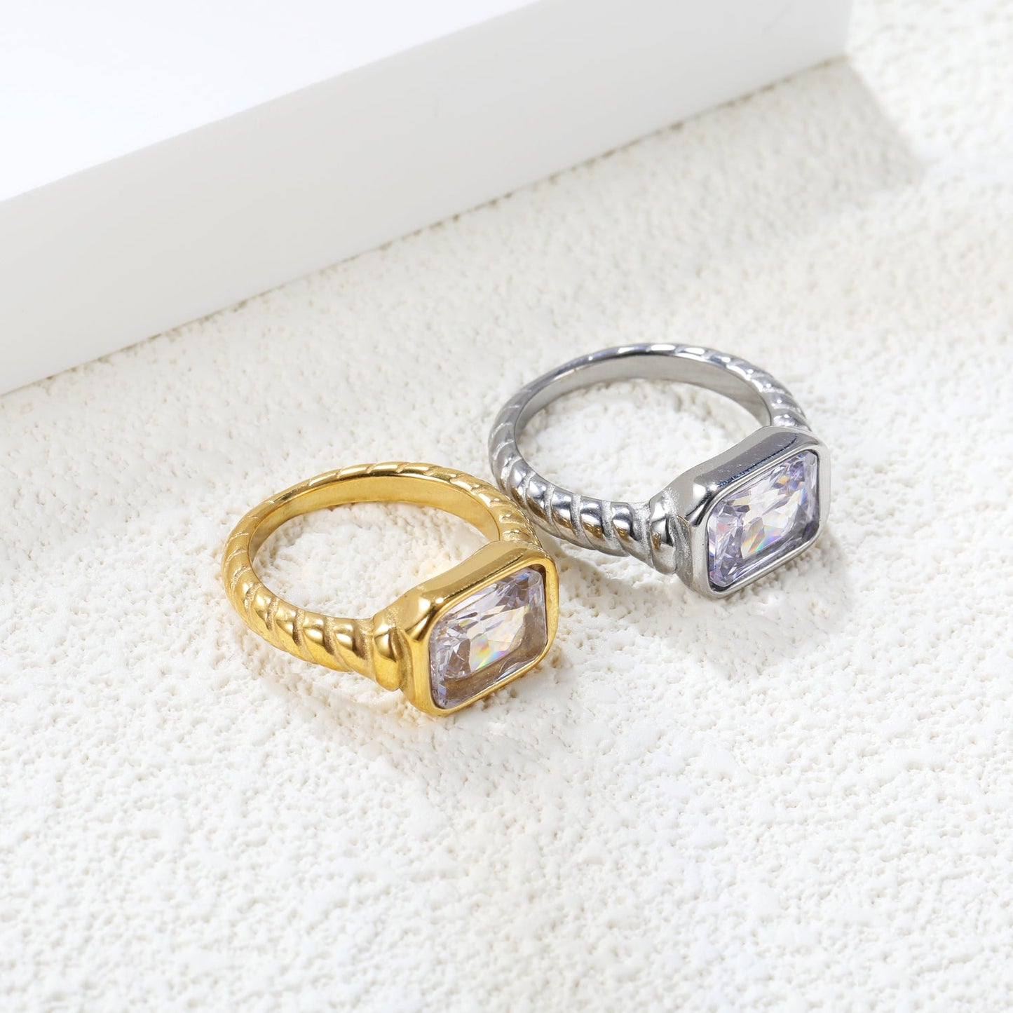 Oversized white diamonds on a threaded band ring.