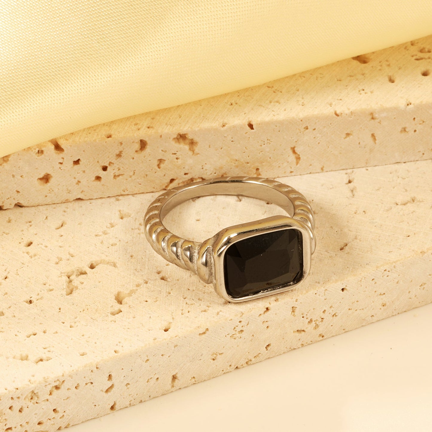Oversized black diamonds on a threaded band ring.
