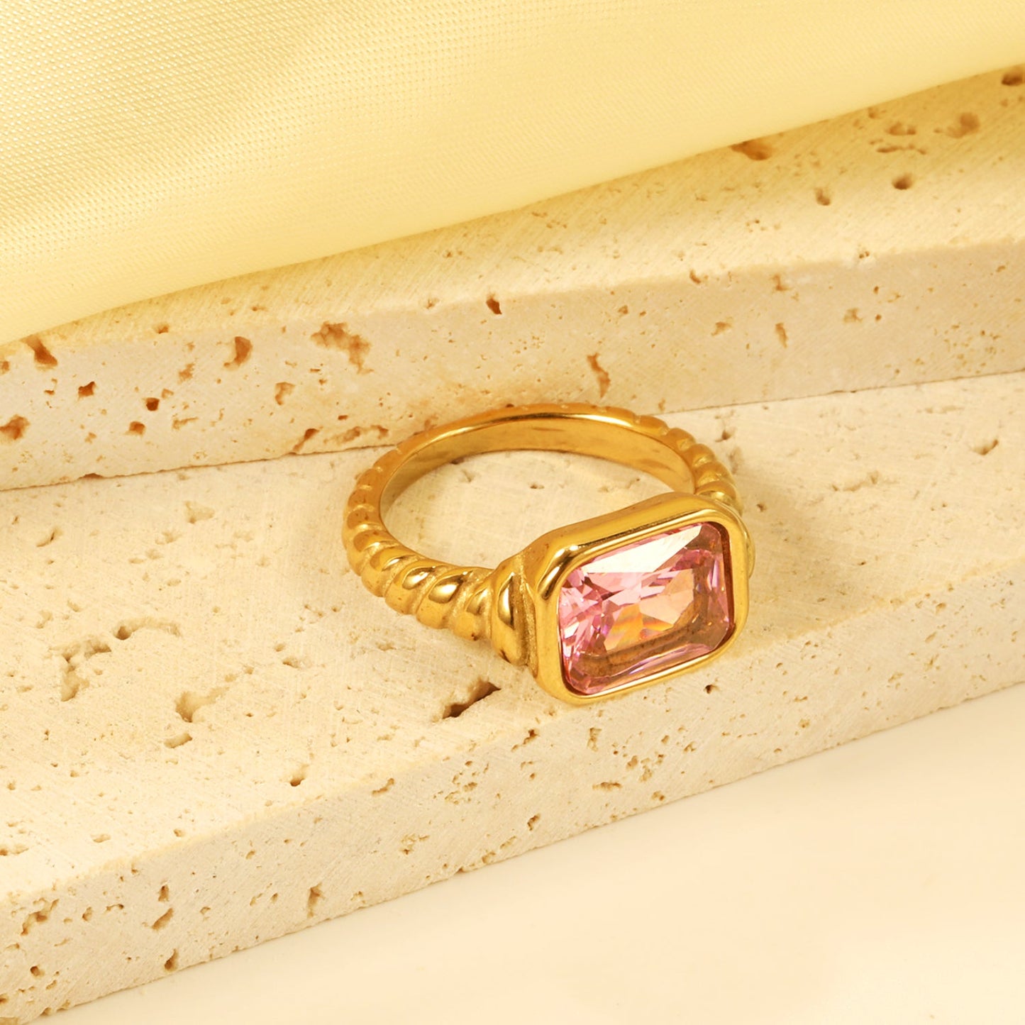Oversized pink diamonds on a threaded band ring.