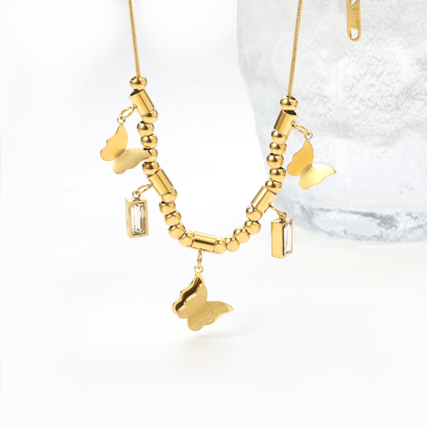 3 size butterflies 12*10mm+2 rectangular white diamond pendants 4.3*8.3mm+22 round through beads+5 round through posts Necklace 41+5cm Gold color