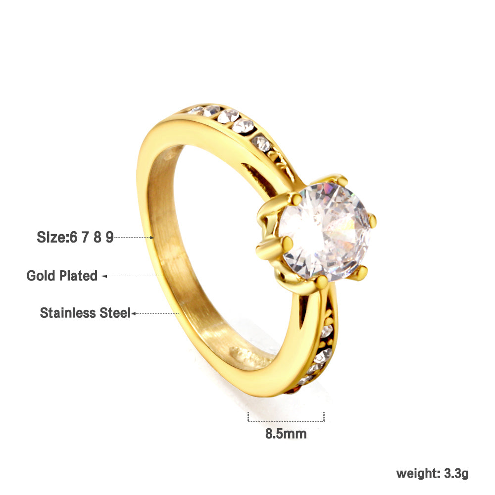 Solitaire ring with several small diamonds + one large round diamond Gold/steel color