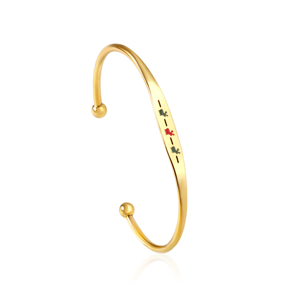 Hard bracelet with oil-drip pattern on gold-colored surface