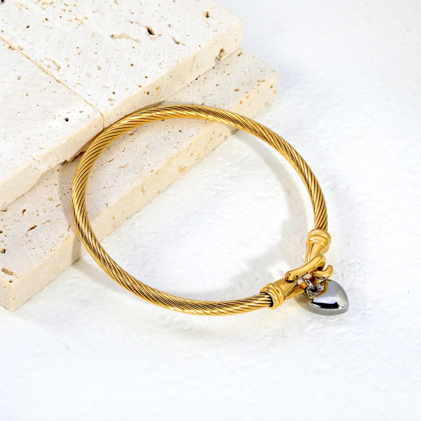 Two-Tone Twisted Cable Wire Bangle with Puffy Heart Charm | 18K Gold Plated Stainless Steel Horseshoe Buckle Cuff Bracelet | Wholesale MOQ 12