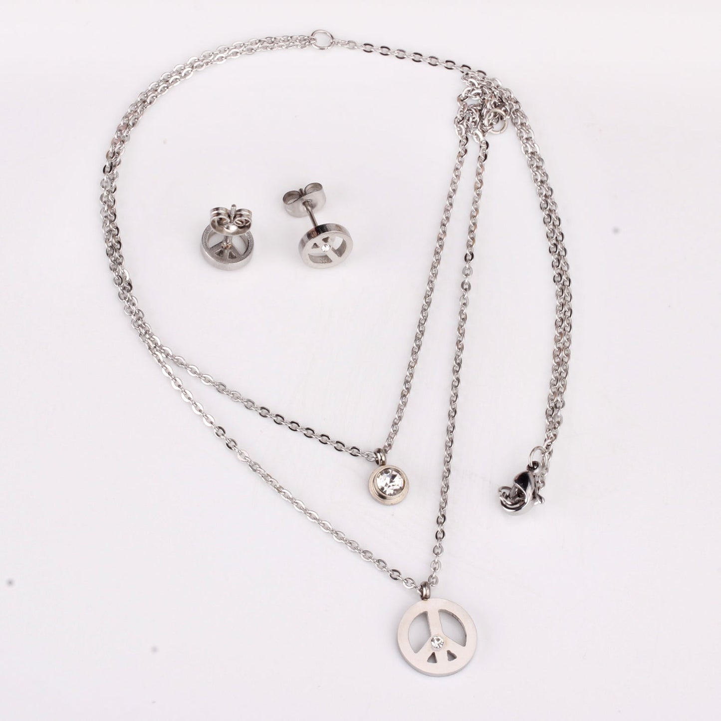 Steel/golden double chain pendant jewelry set with diamonds in the form of a round bridge stand + diamonds on one chain