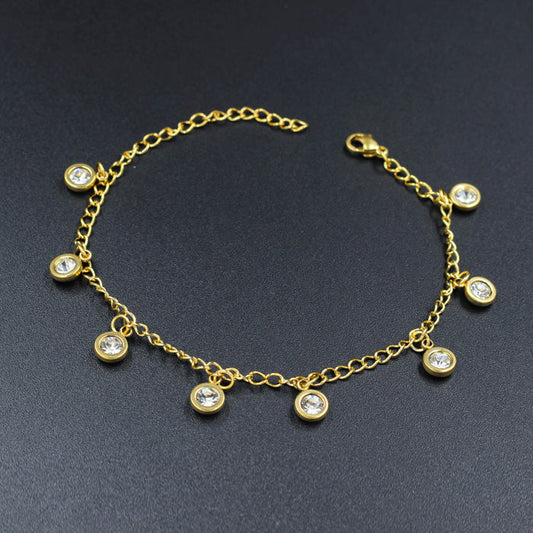 Gold colored soft anklet accessory with pendants and diamonds