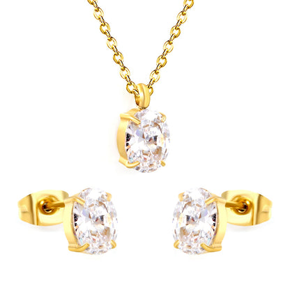Oval white zirconium set Gold-colored earrings: 6*8mm Pendant: 6*8mm 0.3 cross chain *40+5cm+6mm round plate