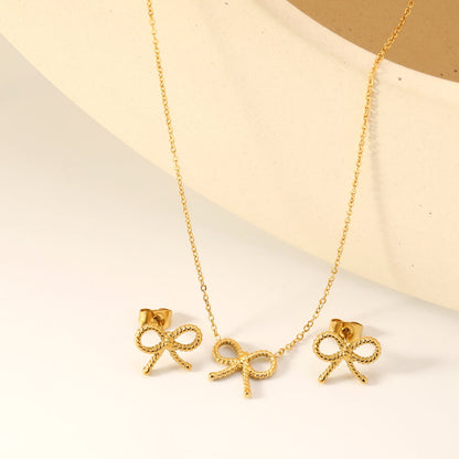 Bow Set Steel Color Earrings:13.2*11.2mm Necklace:13.2*11.2mm0.3 Cross Chain*40+5cm+6mm Round Plaque