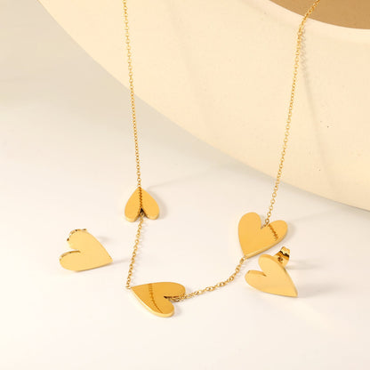 Peach heart set Gold-colored earrings:1.2*12*15mm Pendant:10*12+12*15+13*17mm 0.3 Cross chain*40+5cm+6mm round plaque