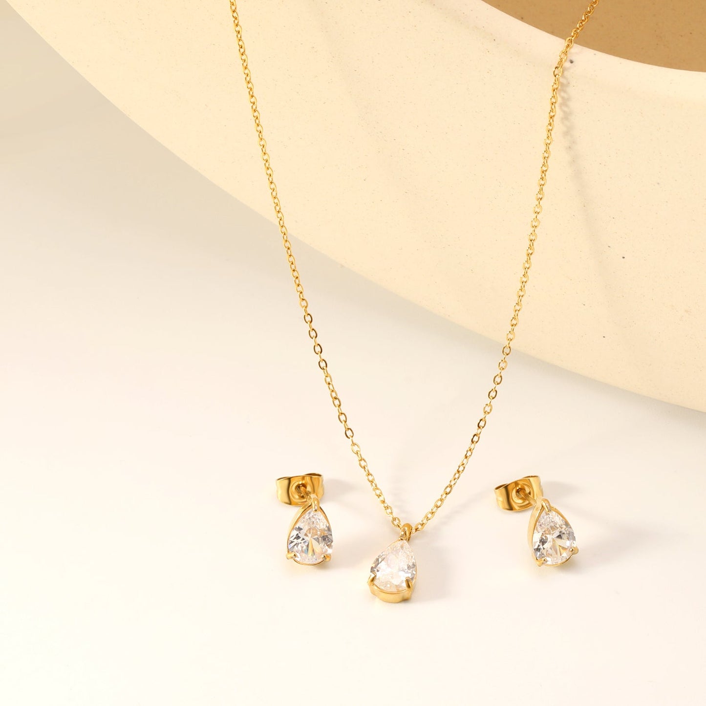 Teardrop white zirconium set Gold-colored earrings:6.1*9.4mm Pendant:6.1*9.4mm 0.3 cross chain*40+5cm+6mm round plaque