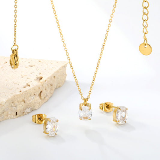 Oval white zirconium set Gold-colored earrings: 6*8mm Pendant: 6*8mm 0.3 cross chain *40+5cm+6mm round plate