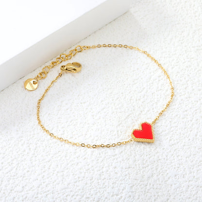 11.2*10.3mm heart shape with white shell/black acrylic/red acrylic fittings 0.35 cross chain*18+3cm+6mm round plaque Bracelet gold color