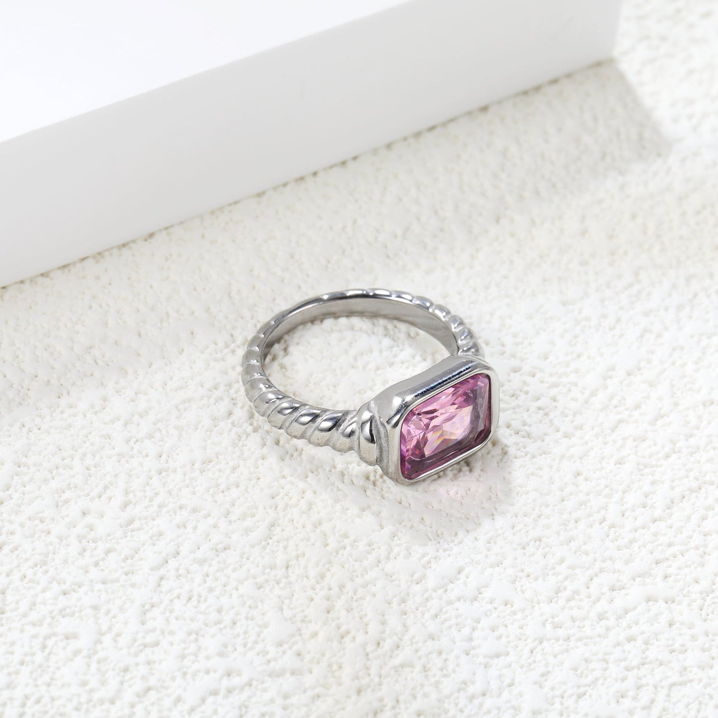 Oversized pink diamonds on a threaded band ring.