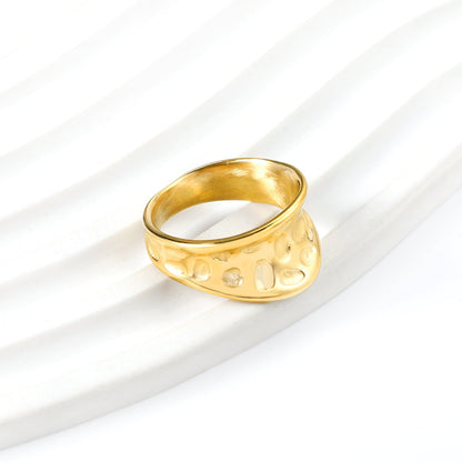 Exaggerated ring with cratered surface
