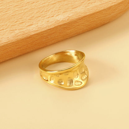 Exaggerated ring with cratered surface