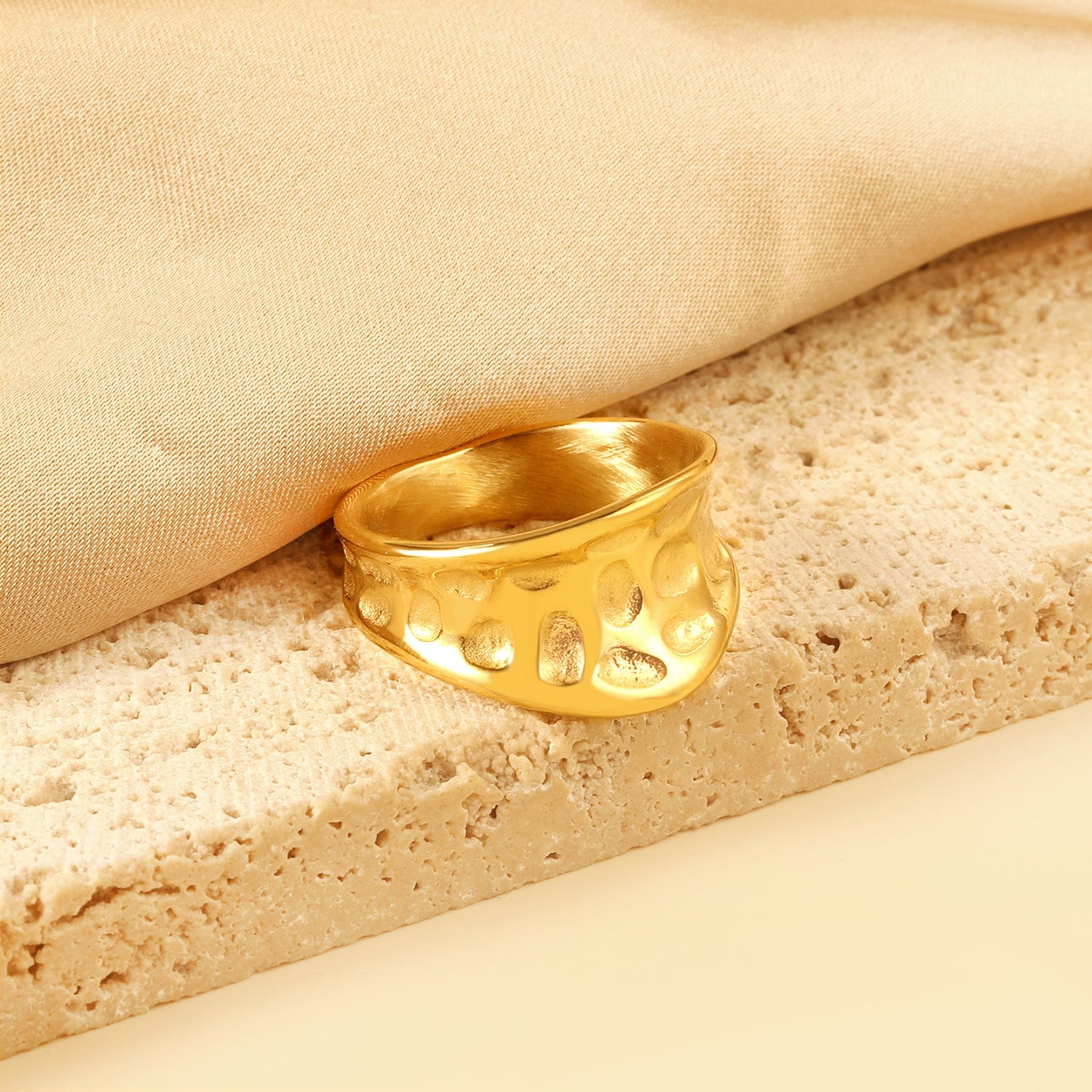 Exaggerated ring with cratered surface