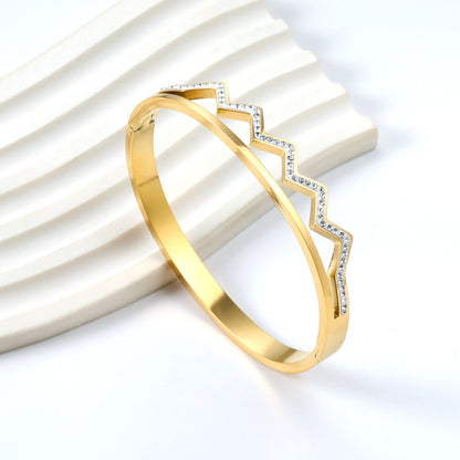 Wavy, diamond-studded hard bracelet like a crown