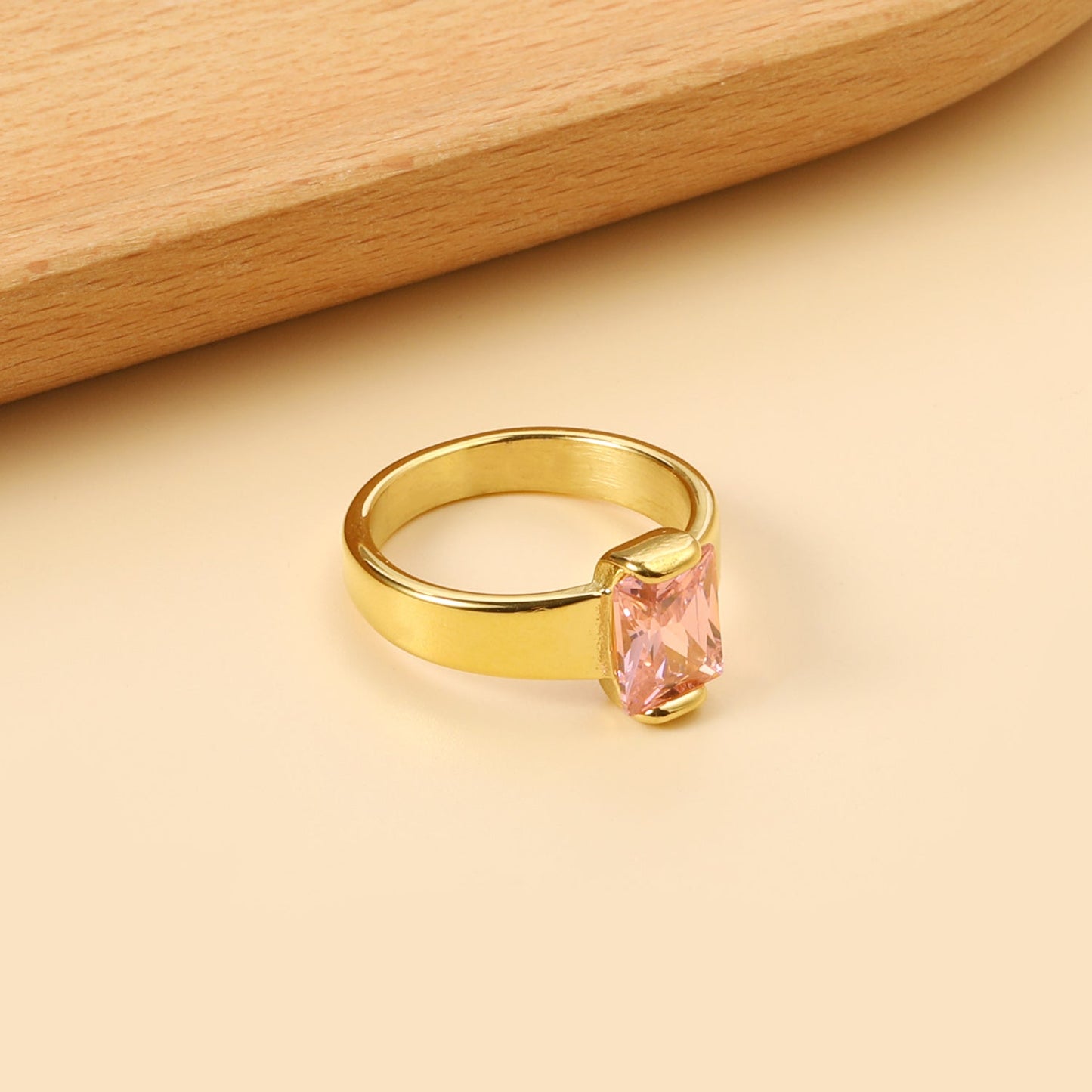Square solitaire ring with pink diamonds