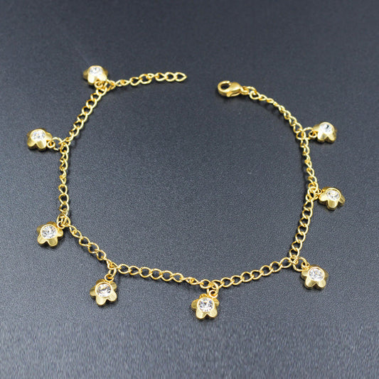 Gold colored soft anklet with multi diamond charms