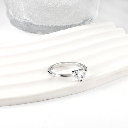 White diamond heart shaped three claw ring