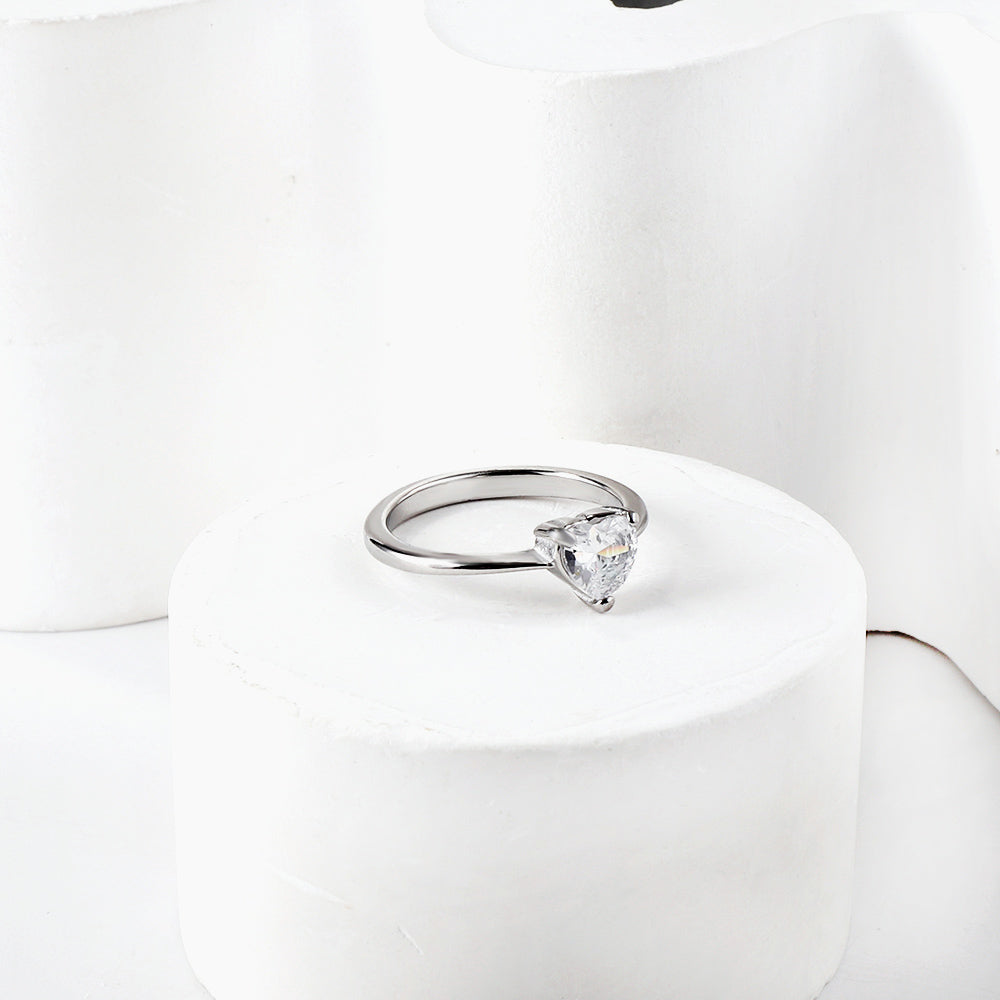 White diamond heart shaped three claw ring