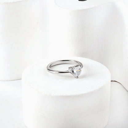 White diamond heart shaped three claw ring