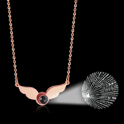 Necklace with a black circle in the center of the wings