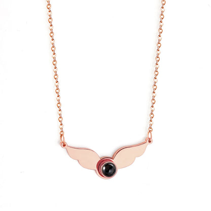 Necklace with a black circle in the center of the wings