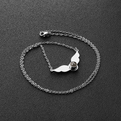 Necklace with a black circle in the center of the wings