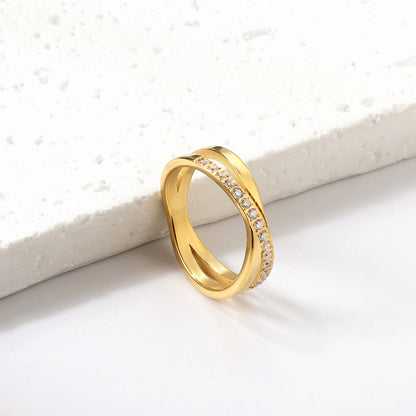 Steel/gold cross over ring with small round diamonds