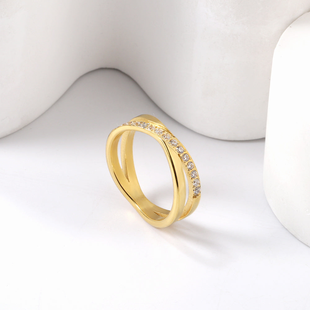 Steel/gold cross over ring with small round diamonds