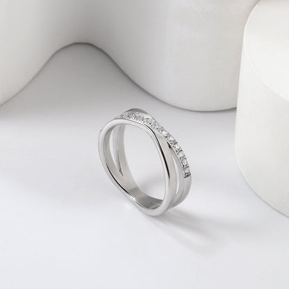 Steel/gold cross over ring with small round diamonds