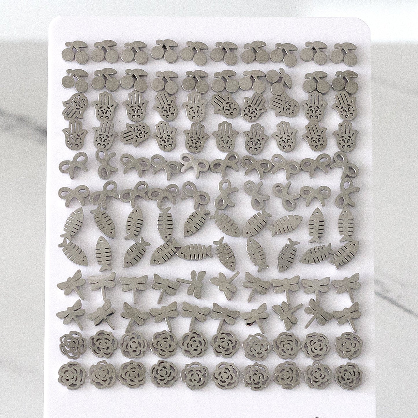 Steel Cherry / Bow / Fishbone Cut Stud Earrings without Diamonds on Card Holder