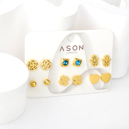 Six pairs of mixed card mounted cut-out palm / glossy heart stud earrings gold color