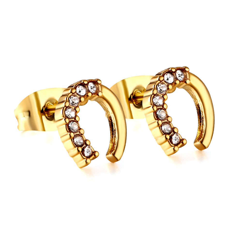 Gold U-shaped cut earrings with diamonds