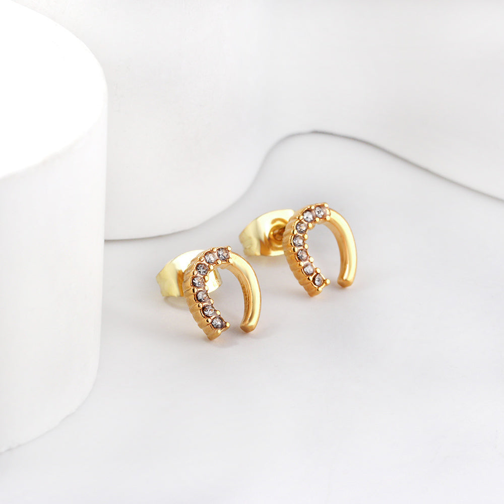 Gold U-shaped cut earrings with diamonds