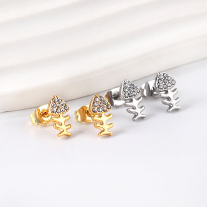 Gold fish bone cut earrings with diamonds