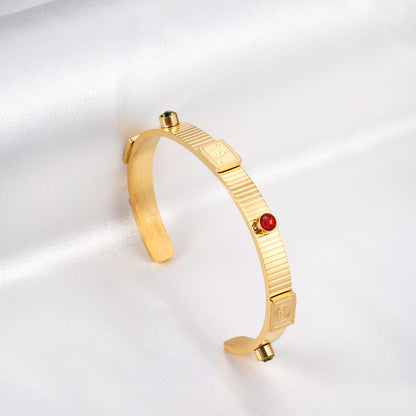 Gold hard bracelet with three different colors and diamonds