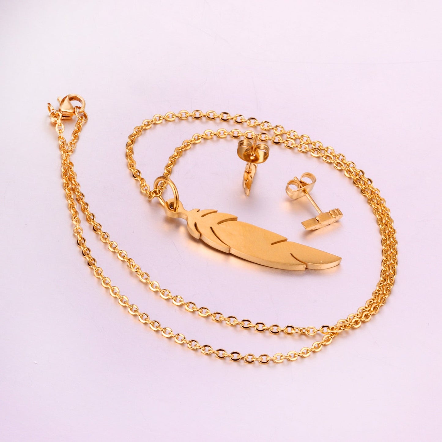 Steel/gold cut small leaf like shape jewelry set without diamonds faceted