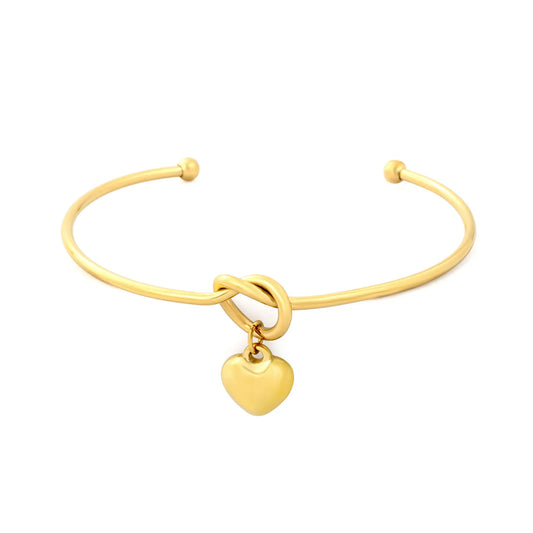 Knot Heart Charm Open Cuff Bangle | 63mm Overall Length | 13.5×11.5mm Knot Detail | 11×12mm Solid Heart Pendant | 18K Gold Plated Stainless Steel Bracelet for Wholesale Supply