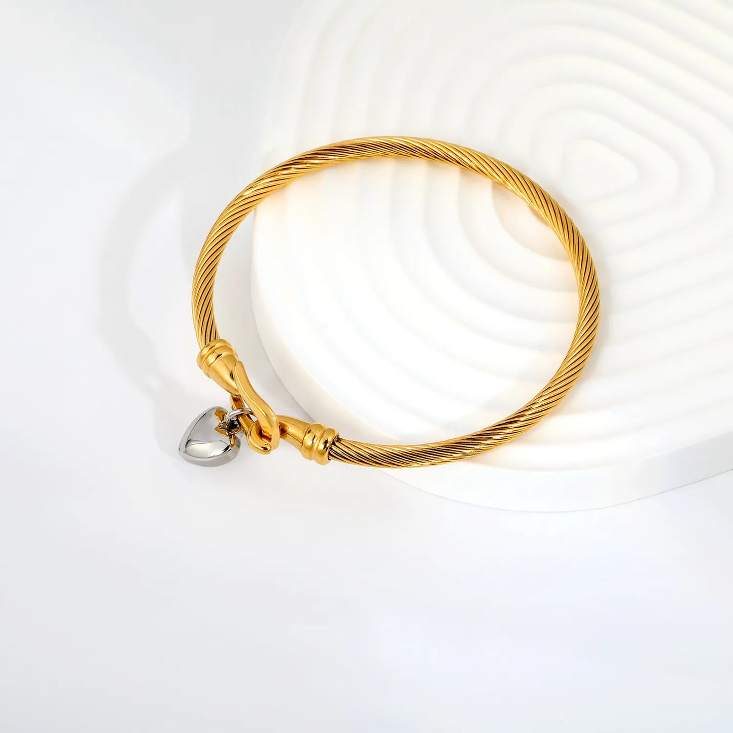 Two-Tone Twisted Cable Wire Bangle with Puffy Heart Charm | 18K Gold Plated Stainless Steel Horseshoe Buckle Cuff Bracelet | Wholesale MOQ 12
