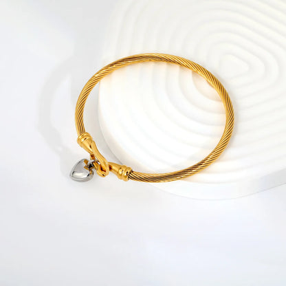 Two-Tone Twisted Cable Wire Bangle with Puffy Heart Charm | 18K Gold Plated Stainless Steel Horseshoe Buckle Cuff Bracelet | Wholesale MOQ 12