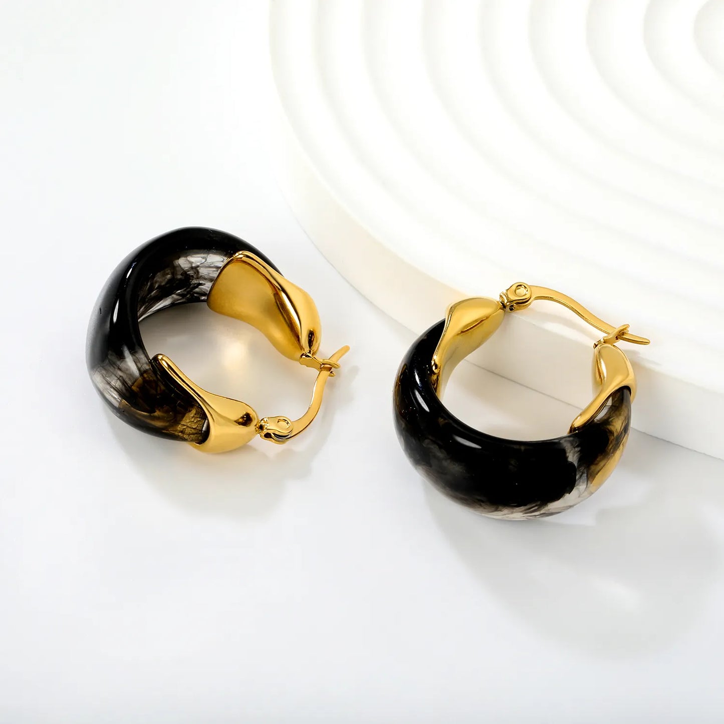 Black Marble Resin Hoop Earrings with Sculpted Gold Detail – 18K Gold Plated | Wholesale MOQ 12  Description: