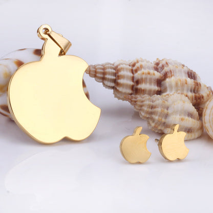 Set of jewels in gold/steel with a smooth surface of an apple with a bite.