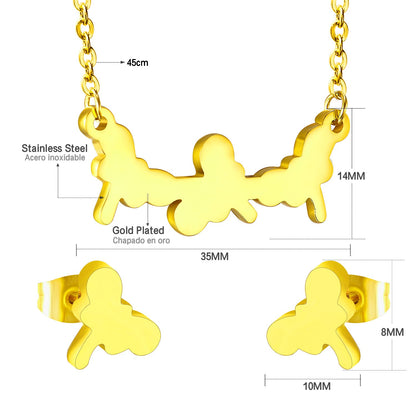 Jewelry set in gold/steel with smooth surfaces and irregular cuts