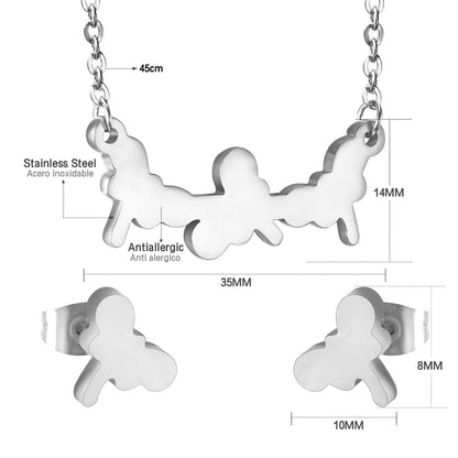 Jewelry set in gold/steel with smooth surfaces and irregular cuts