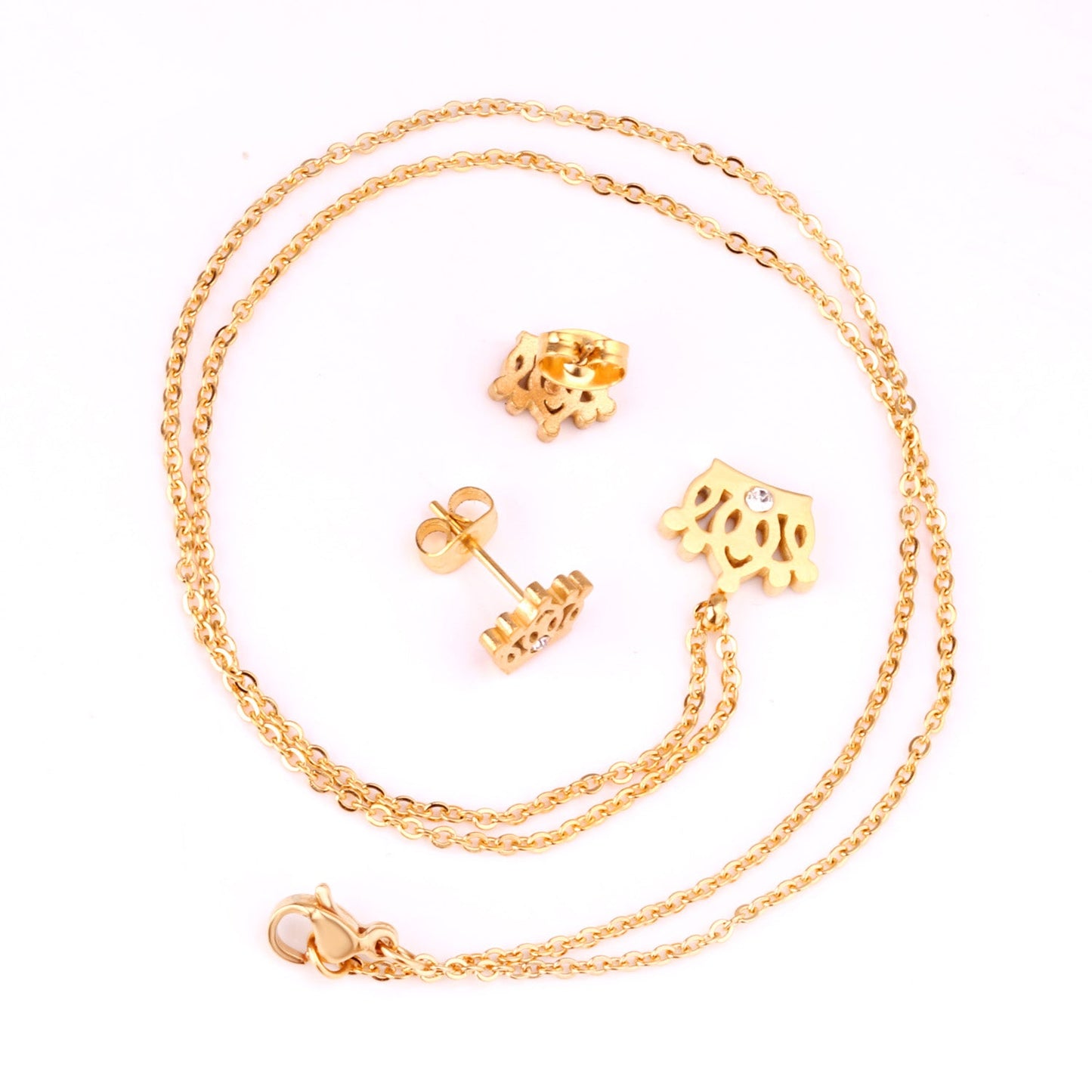 Gold/steel cut crown shape jewelry set with diamonds