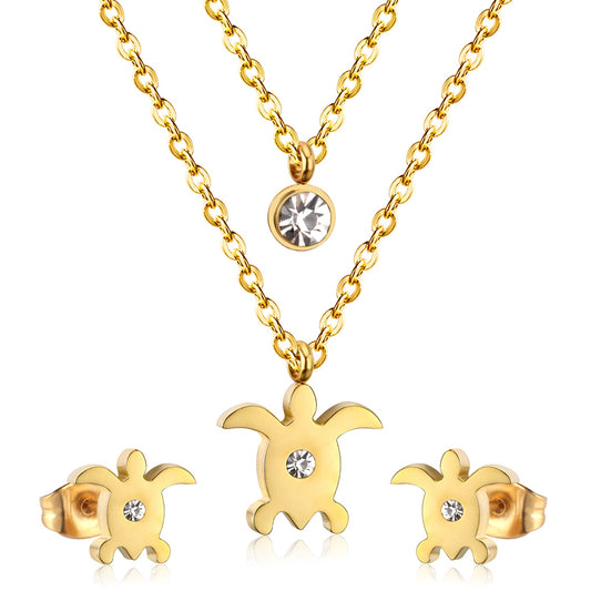 Gold/steel double chain pendant jewelry set in the shape of a small sea turtle with diamonds