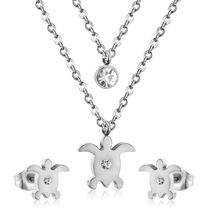 Gold/steel double chain pendant jewelry set in the shape of a small sea turtle with diamonds