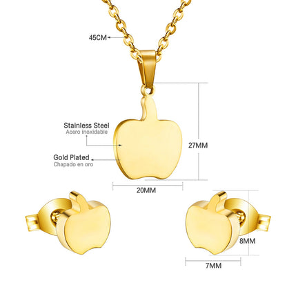 Gold/steel colored cut jewelry set with a golden apple on the cutting process